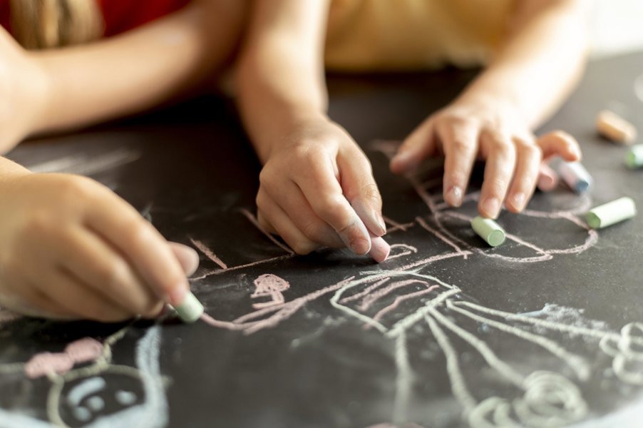 Hands Drawing With Chalk Close Up